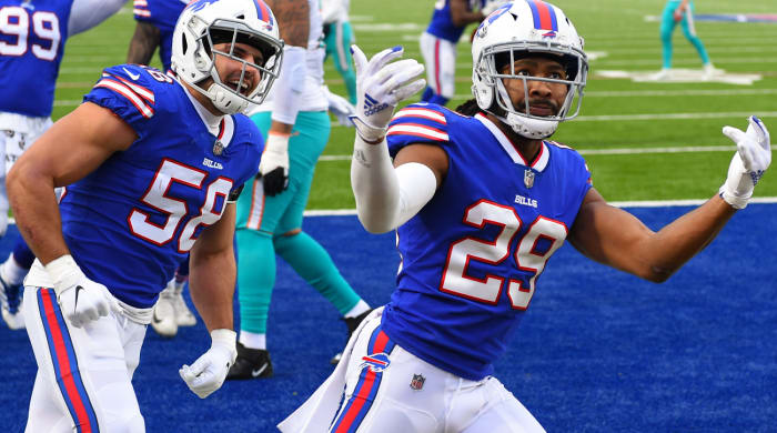 Jan 3, 2021; Orchard Park, New York, USA; Buffalo Bills cornerback Josh Norman (29) reacts to his interception return for a touchdown with teammate outside linebacker Matt Milano (58) against the Miami Dolphins during the third quarter at Bills Stadium. Mandatory Credit: Rich Barnes-USA TODAY Sports